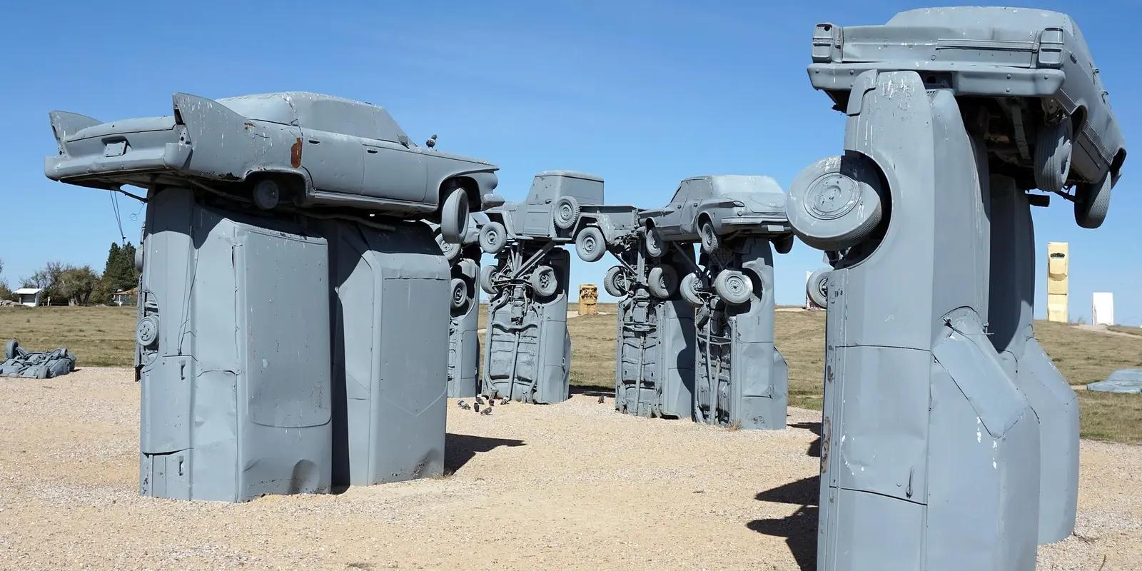 Carhenge art installation with vintage cars painted gray and arranged like Stonehenge in Nebraska.
