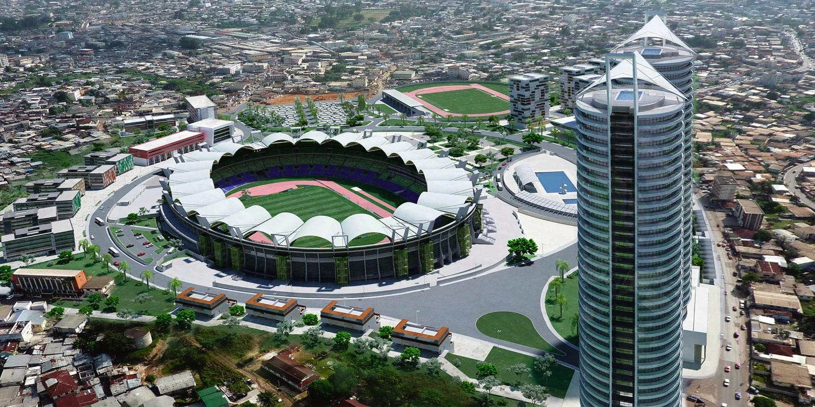 Aerial rendering of a modern sports stadium complex and a sleek, futuristic high-rise tower within the urban landscape of Libreville, Gabon.