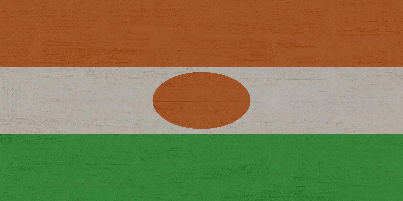 The national flag of Niger, featuring horizontal stripes of orange, white, and green, with an orange circle in the center.